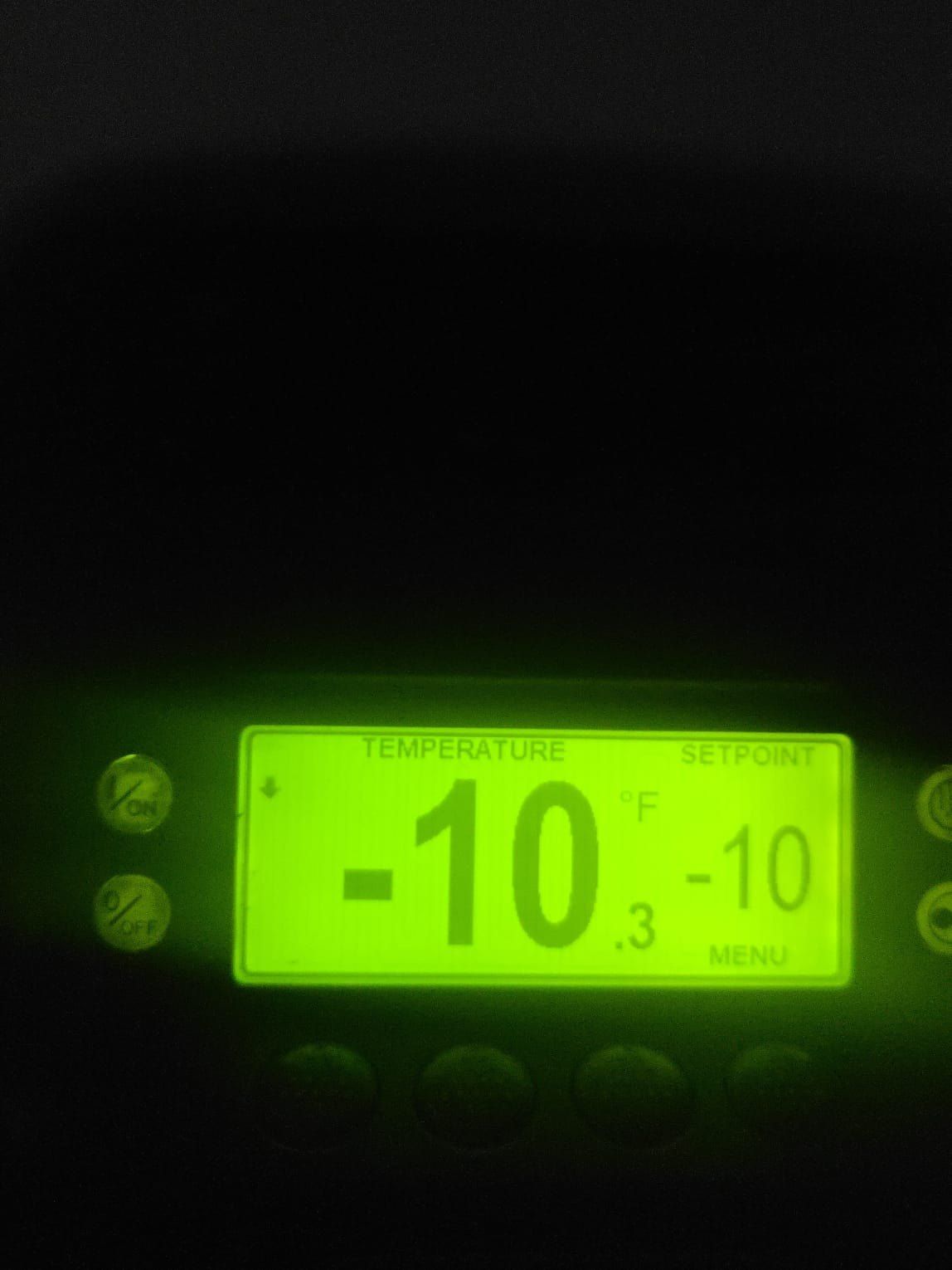 Reefer controller display glowing in the dark during a night repair