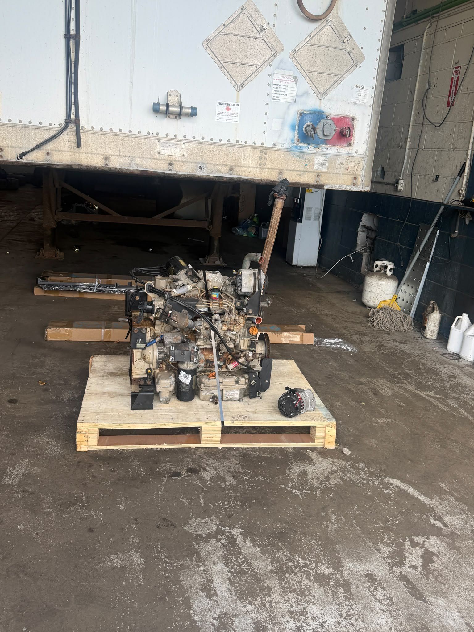 Reefer engines on a pallet in the shop